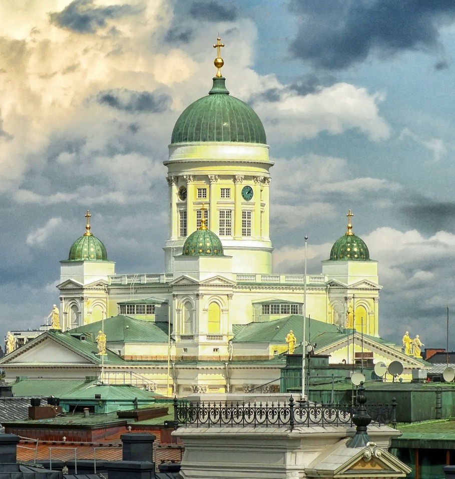 Helsinki Cathedral against a dramatic blue and cloudy sky