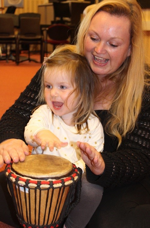 Mother and child on djembe