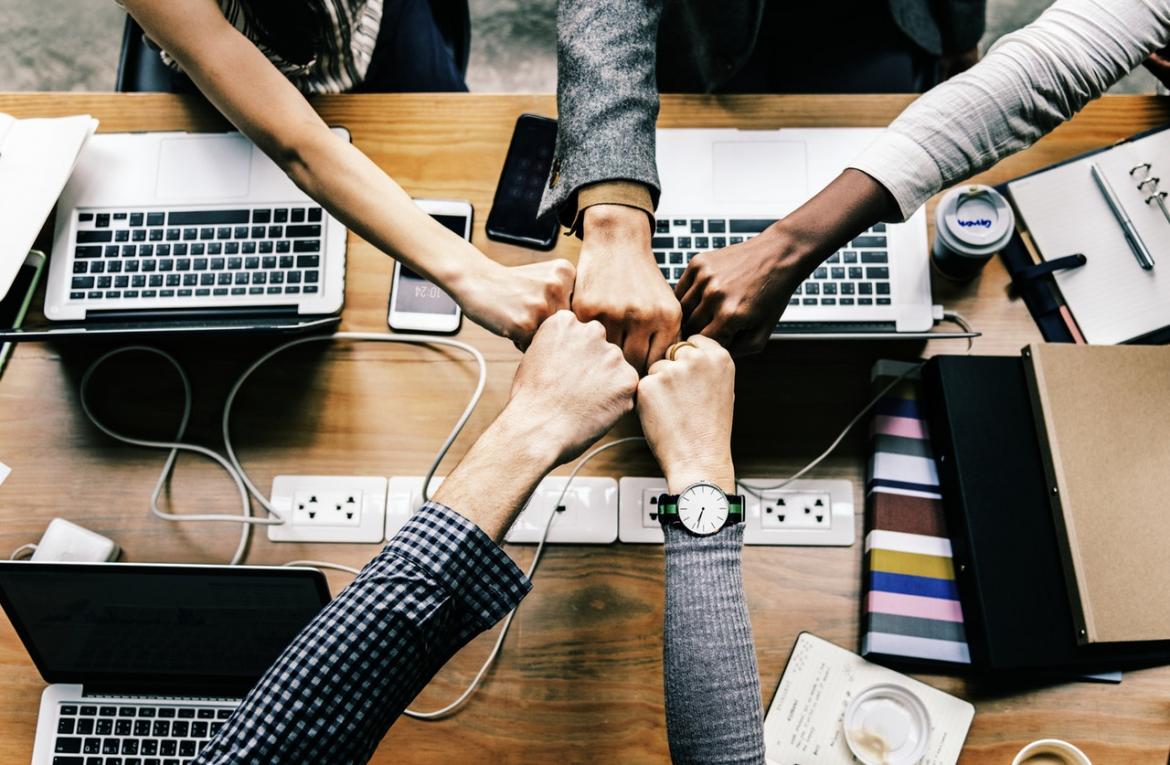 Hands all bumping together as a team