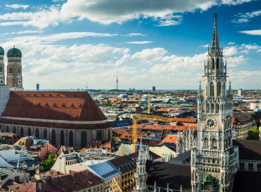 View over roofs in Munich. Churches, red roof tiles.