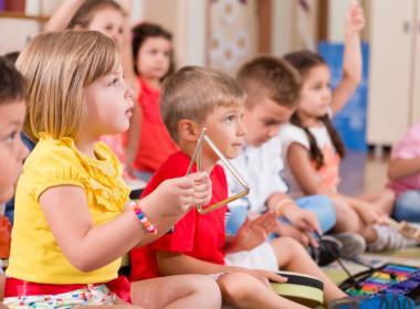 Kindergarten children playing classroom instruments