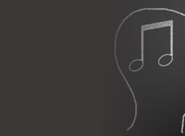 A head with music notes in it, drawn on a blackboard